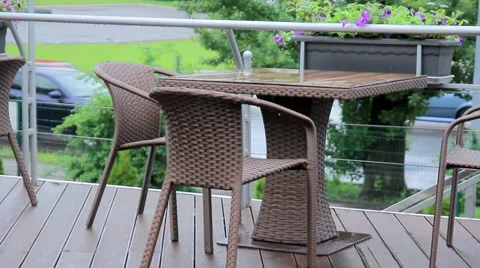 Raindrops on railing of an outdoor cafe Stock Footage 63440936