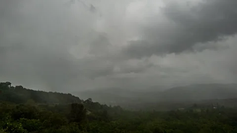 Raindrops, Rain, and Clouds Engulf California Mountain Town Time Lapse Stock Footage 279648310