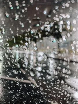 Raindrops on a rainy night Stock Photos