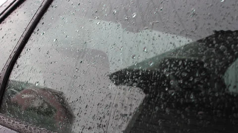 Raindrops on the rear car window Stock Footage 24739152