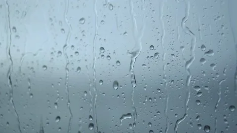 Raindrops roll down on the window. Bad depressive weather, heavy rain and wind Stock Footage 159528259