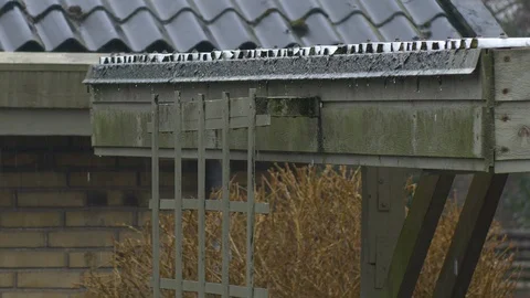 Raindrops from roof closeup Stock Footage 87029301