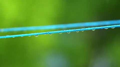 Raindrops on the rope falling down when raining. Stock Footage 137192234