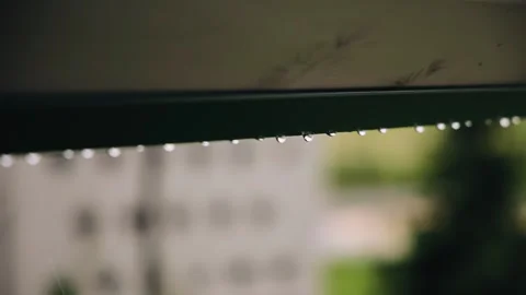 Raindrops run down from the canopy during bad weather Stock Footage 317787400
