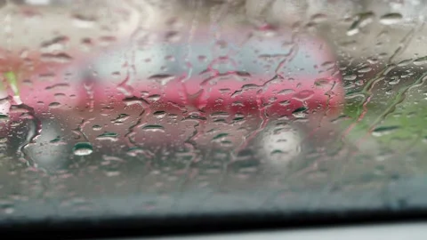 Raindrops run down the car window. it's raining, it's bad weather outside. the Stock Footage 165061895