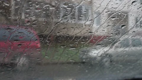 Raindrops run down the car window. it's raining, it's bad weather outside Stock Footage 166110749