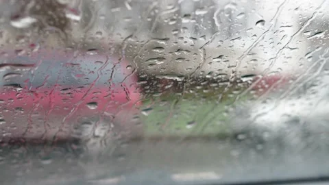 Raindrops run down the car window. it's raining, it's bad weather outside. the Stock Footage 166524368