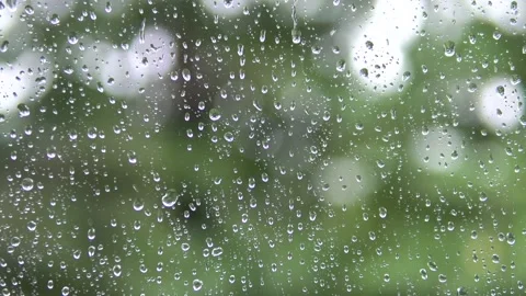 Raindrops run down the glass of the window. Stock Footage 136471013