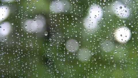 Raindrops run down the glass of the window. Stock Footage 136619099