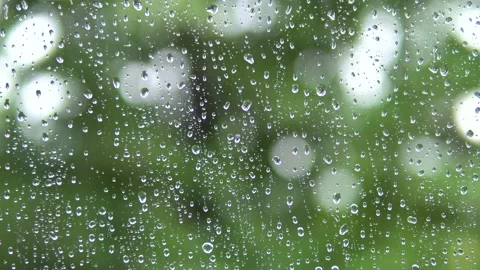 Raindrops run down the glass of the window. Stock Footage 136899502