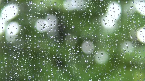 Raindrops run down the glass of the window. Stock Footage 136967766