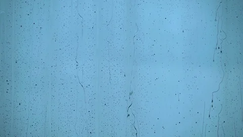 Raindrops run down the window day Stock Footage 112018332