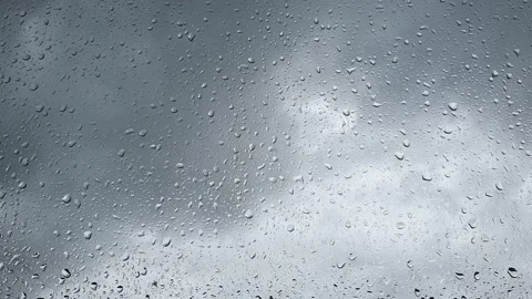 Raindrops run down the window glass Stock Footage 196917171