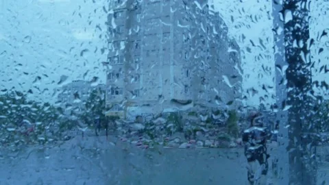 Raindrops run down the window pane Stock Footage 131360744