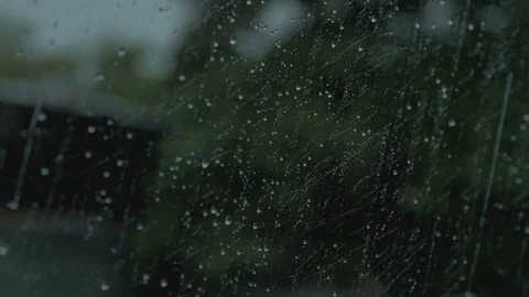 Raindrops running down the car window Stock Footage 73590193