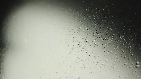 Raindrops running down glass. A close-up of foggy glass decorated with raindrops Stock Footage 318065360
