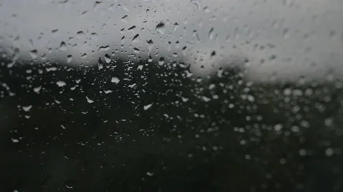 Raindrops running down the window of a car, in New Zealand Stock Footage 217399179