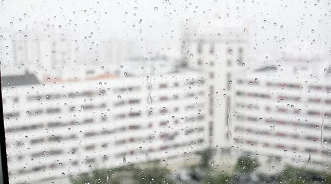 Raindrops running down a window glass in the rain Stock Footage 68902959