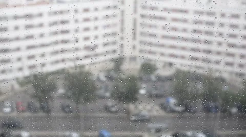 Raindrops running down a window glass in the rain Stock Footage 68903006