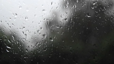 Raindrops running down a window. Sad autumn. Looking out the window. Stock Footage 333166865