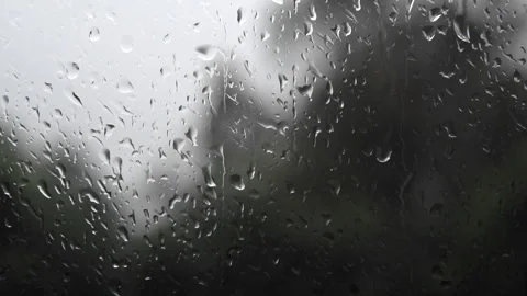 Raindrops running down a window. Sad autumn. Looking out the window Stock Footage 333176630