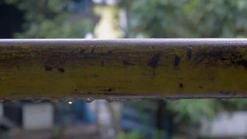 Raindrops On Rusty Railing Close Up Video stock 338343281