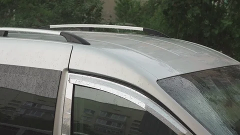 Raindrops on a silver car closeup Stock Footage 109392839