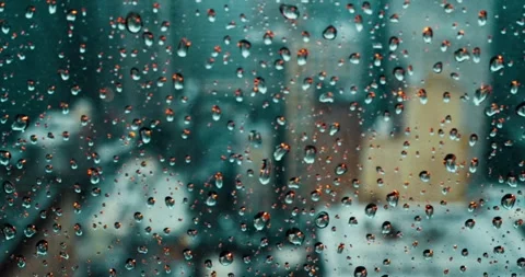 Raindrops on Skyscraper Window with Cityscape View Video stock 323147329