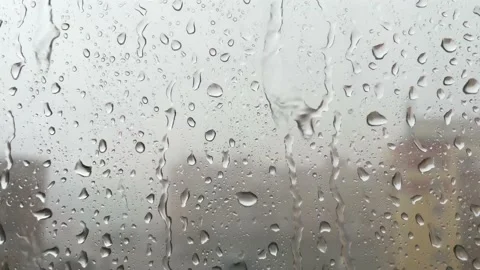 Raindrops slide and run down the glass. Stock Footage 192484203