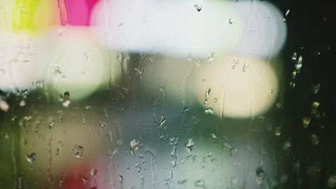 Raindrops Sliding Down Glass Window Blurred City Lights Background Stock-Footage 334852301