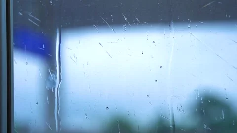 Raindrops Sliding Down A Glass Window During A Gloomy Overcast Rainy Day Vídeos de archivo 341957712