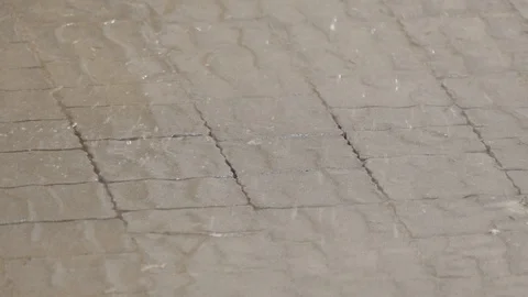 Raindrops slow falls at cobblestone In the opposite direction Stock Footage 116795403