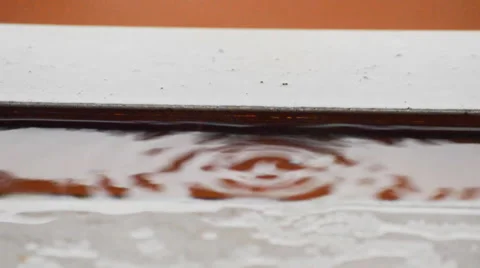 Raindrops Slowly Falling Into Water Stock Footage 48133014