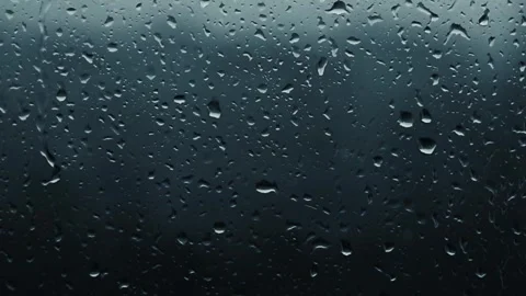 Raindrops slowly slide down the window glass, downpour, rainy season 库存影片 333649640