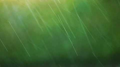 Raindrops on soft green and yellow bokeh background. Beautiful natural rain Stock Footage 87866063