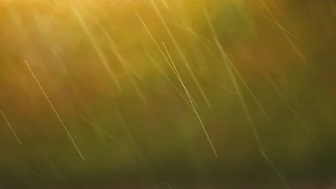Raindrops on soft orange and yellow bokeh background. blurred rain pattern. Stock Footage 87852496