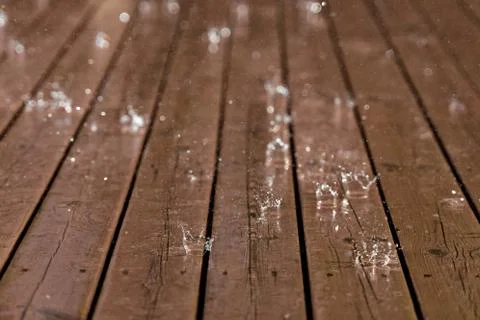 Raindrops splash down on floor 库存照片