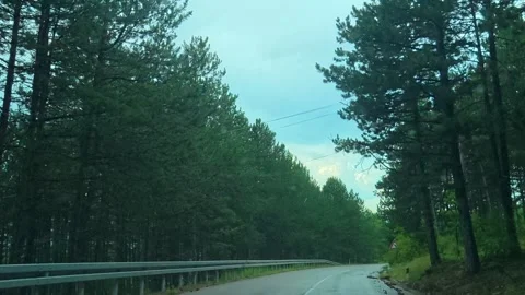 Raindrops streak the windshield. Balkan Mountains, Serbia 스톡 동영상 341876879