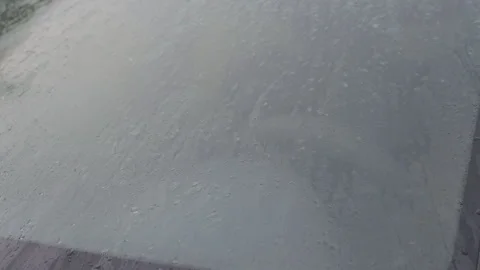 Raindrops on surface of car windscreen glass close up. Stock Footage 249551488