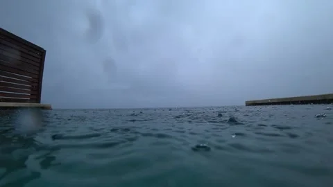 Raindrops on the surface of the pool water Video stock 282669850
