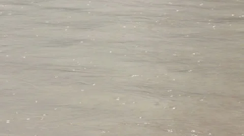 Raindrops on surface water. Flood muddy river flowing. Downpour. Waves. Close up Stock Footage 38996964