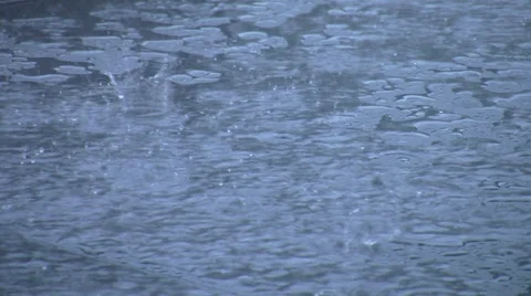 Raindrops on a table with sound Stock Footage 32508124