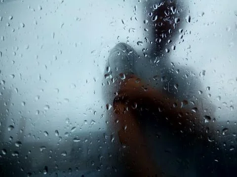 Raindrops on a textured window Stock Photos