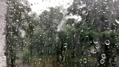 Raindrops through the glass. Storm, hurricane and strong wind through the glass Stock Footage 132697340