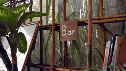 Raindrops trace fleeting patterns down the window of a warm and inviting Stock Footage 277000692