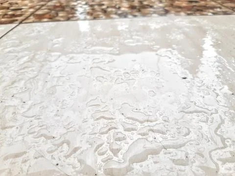 Raindrops trace on the marble floor 스톡 사진