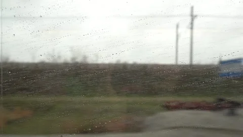 Raindrops on a train window Stock Footage 332883195
