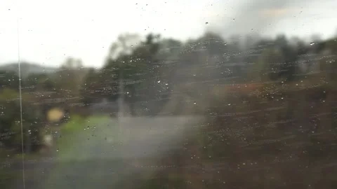 Raindrops on a train window Stock Footage 332883213