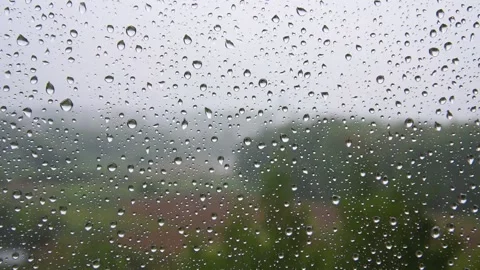 Raindrops trickle down the glass. Stock Footage 131927236