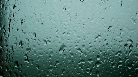 Raindrops trickle down the glass. lightning flashes in the background Stock Footage 147455732